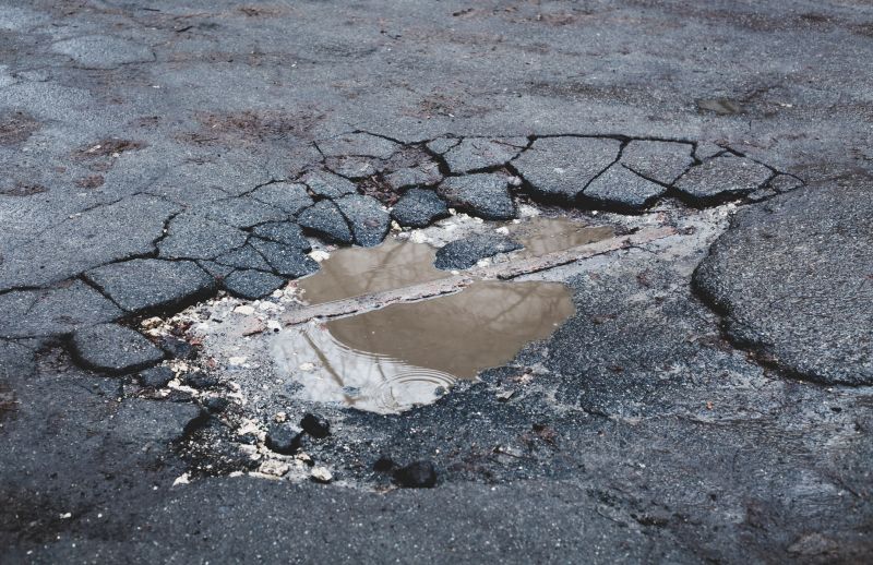 How Weather Conditions Affect Asphalt Cracks And Potholes